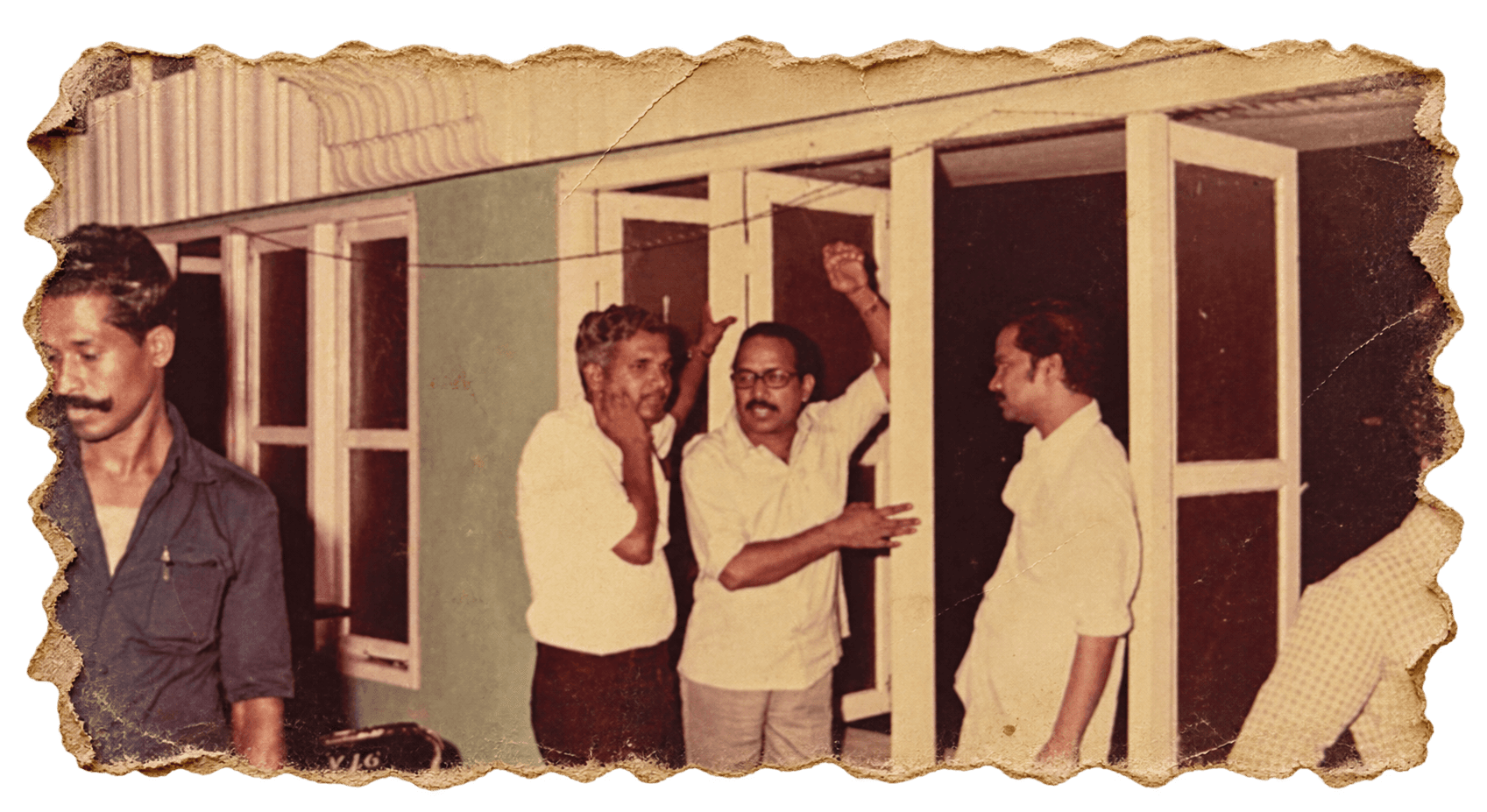 Early committee members in discussion outside the venue